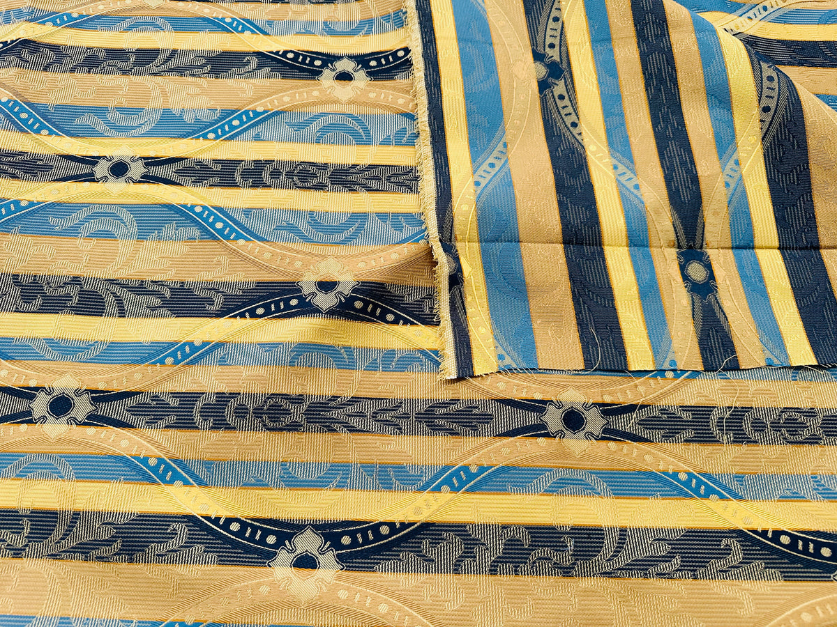 remnant of yellow/blue striped jacquard furnishing fabric