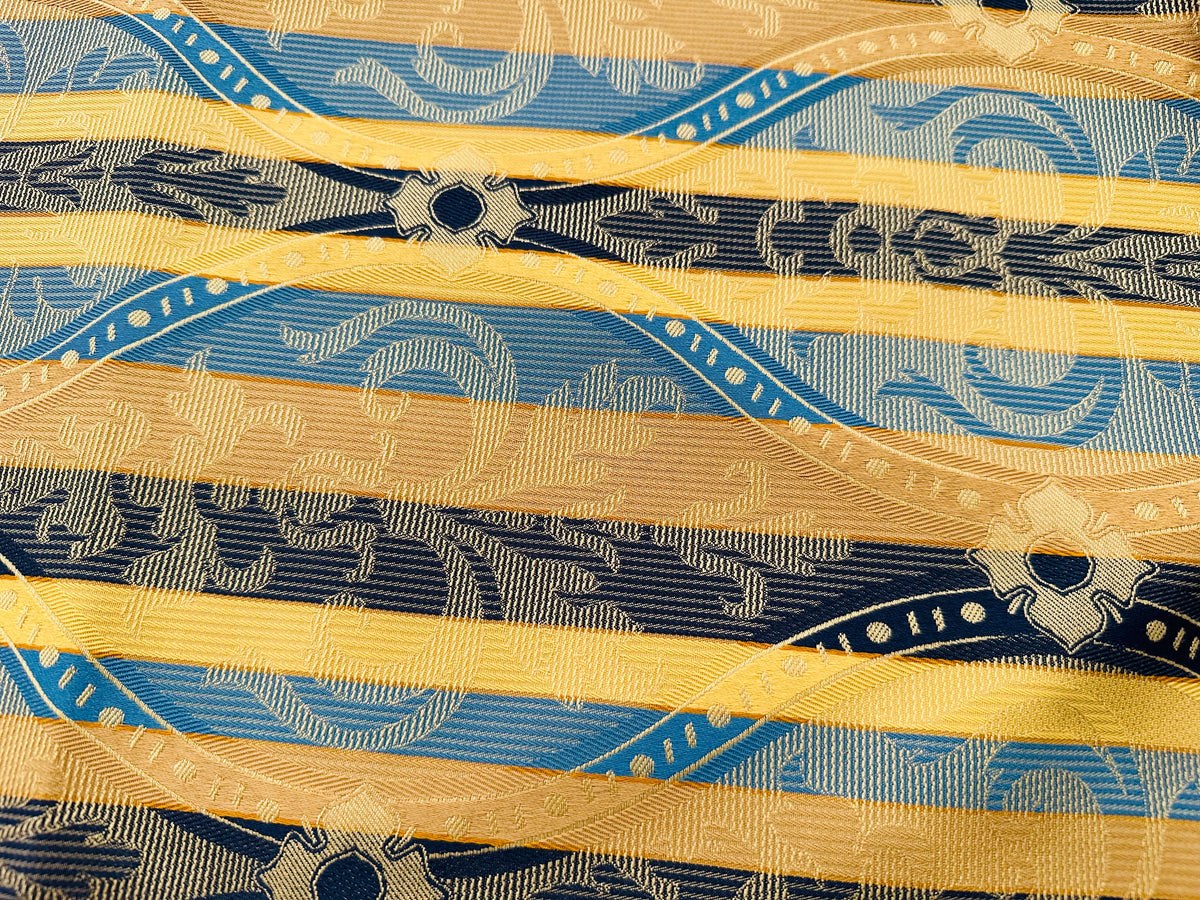 remnant of yellow/blue striped jacquard furnishing fabric