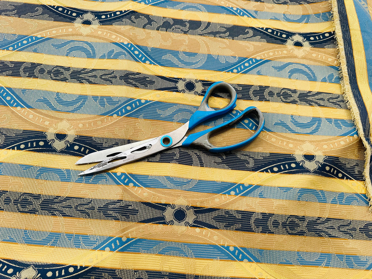 remnant of yellow/blue striped jacquard furnishing fabric